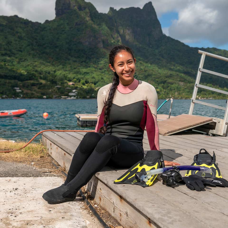 Nury Molina sitting in wetsuit at Gump Research Station